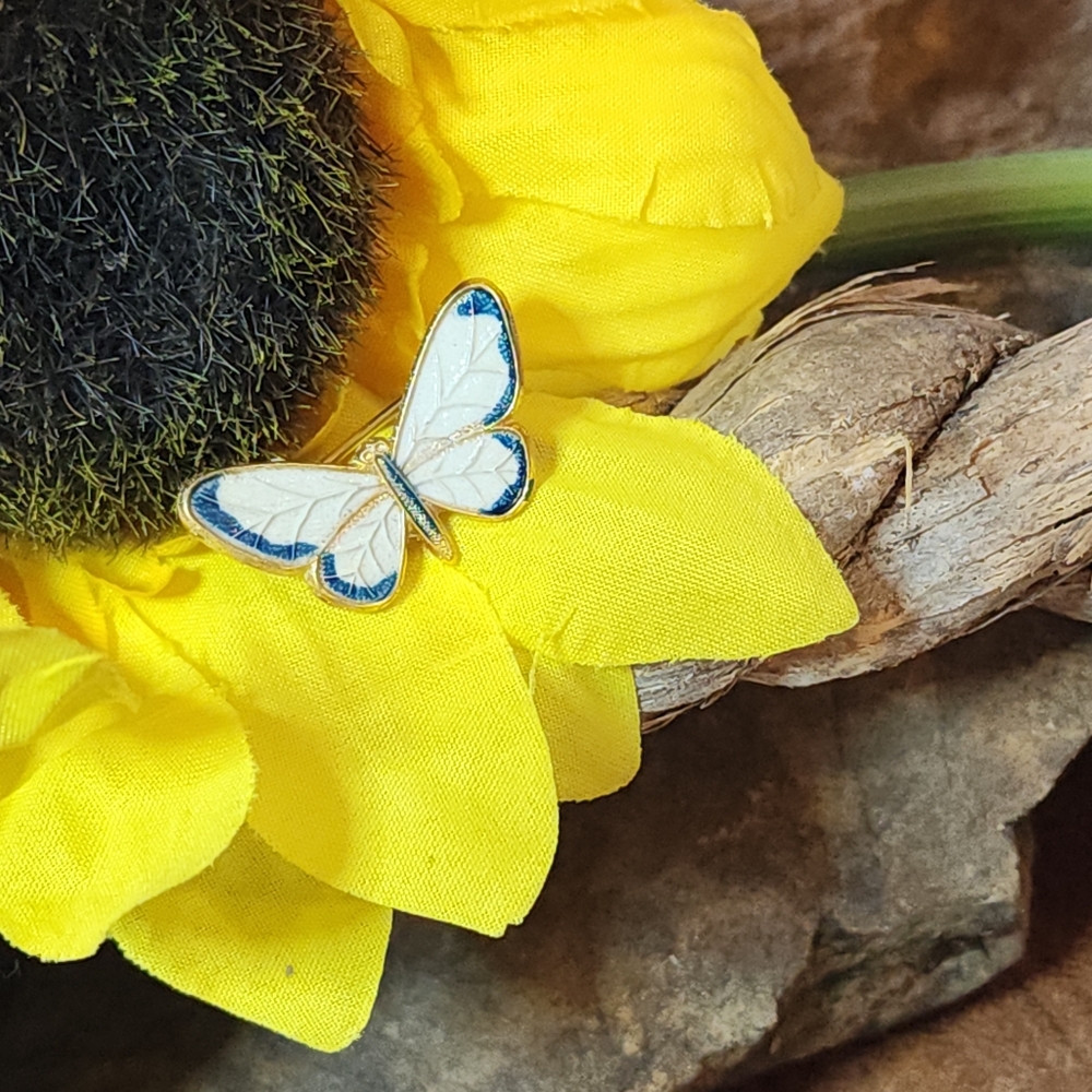 Small White and Blue Enamel Butterfly Brooch with a gold-tone setting